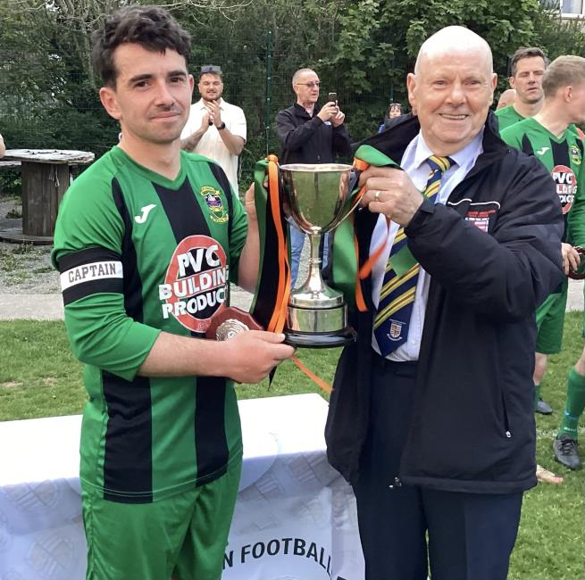 Solva 2nds captain Luke Jones receives the silverware from Trevor Morgans Solva 2nds captain Luke Jones receives the silverware from Trevor Morgans